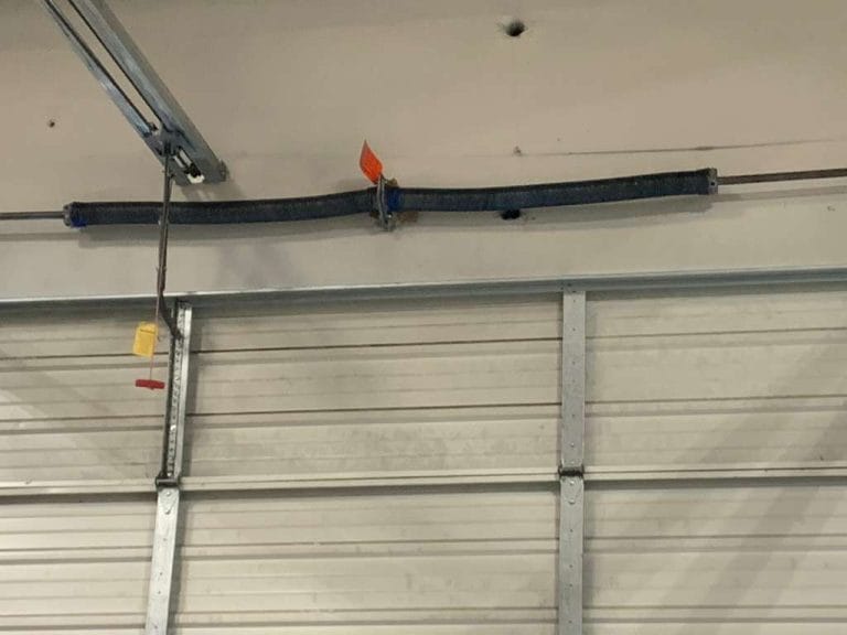 Torsion spring on a garage door shaft