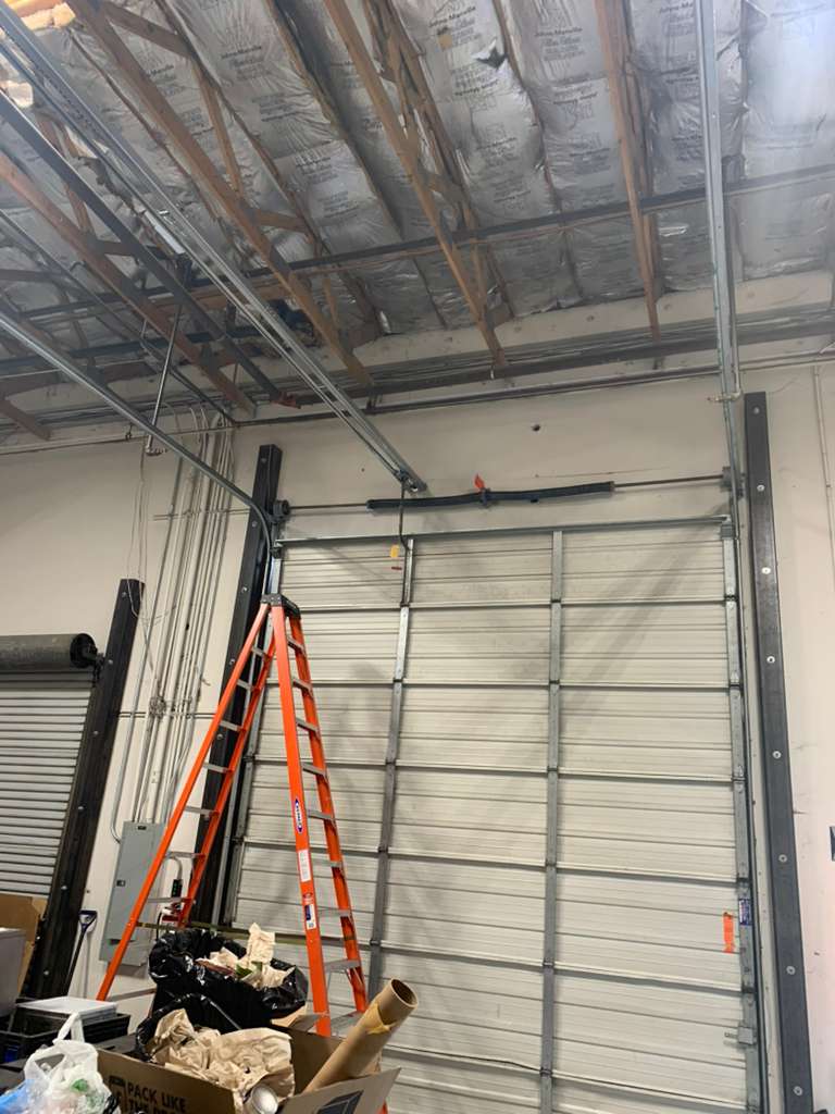 Garage door track and ladder inside a Las Vegas garage