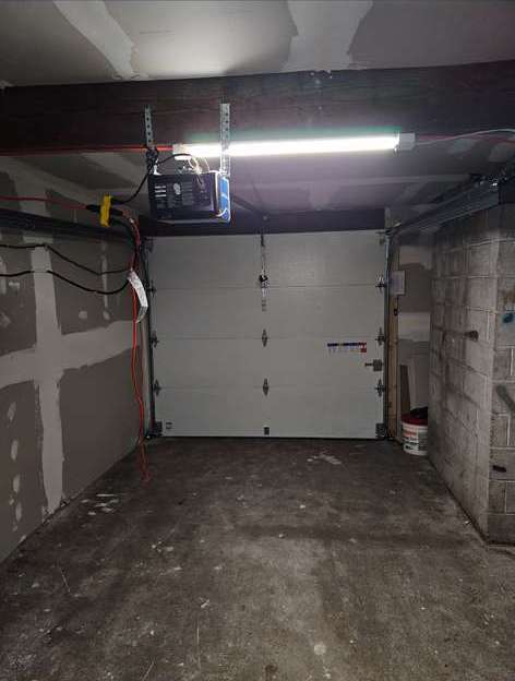 Inside of a garage with the door closed and a clear floor